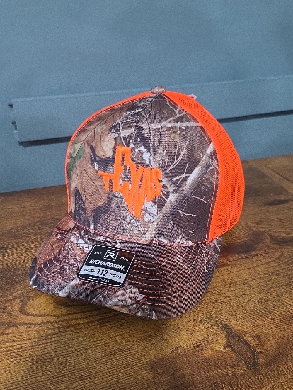 Richardson Camo Trucker Hat with Neon Orange Texas Logo